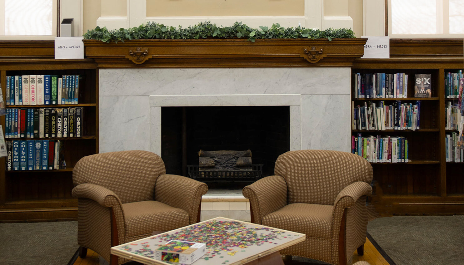 Image of a fireplace and sofas